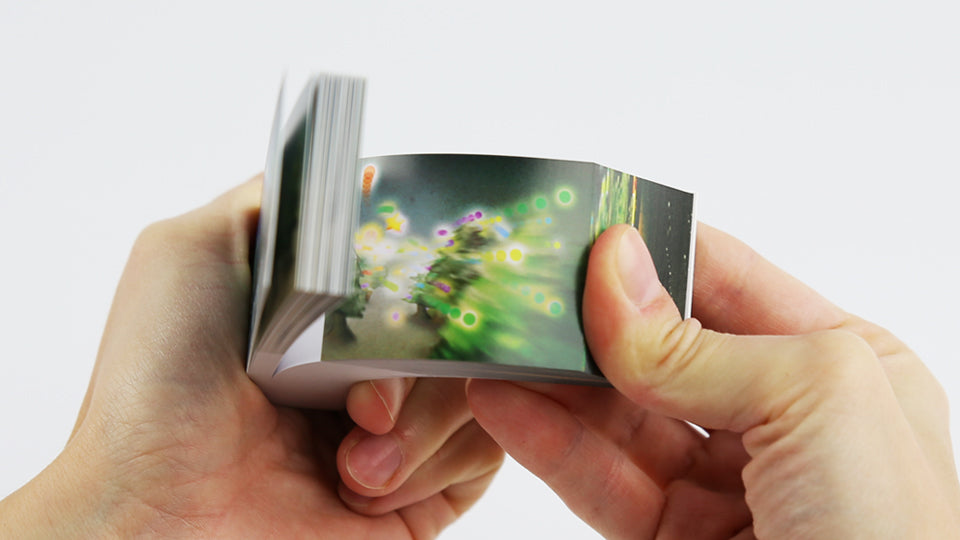 Christmas flip book by Mohiken, published by Seigensha Art Publishing in 2011. 